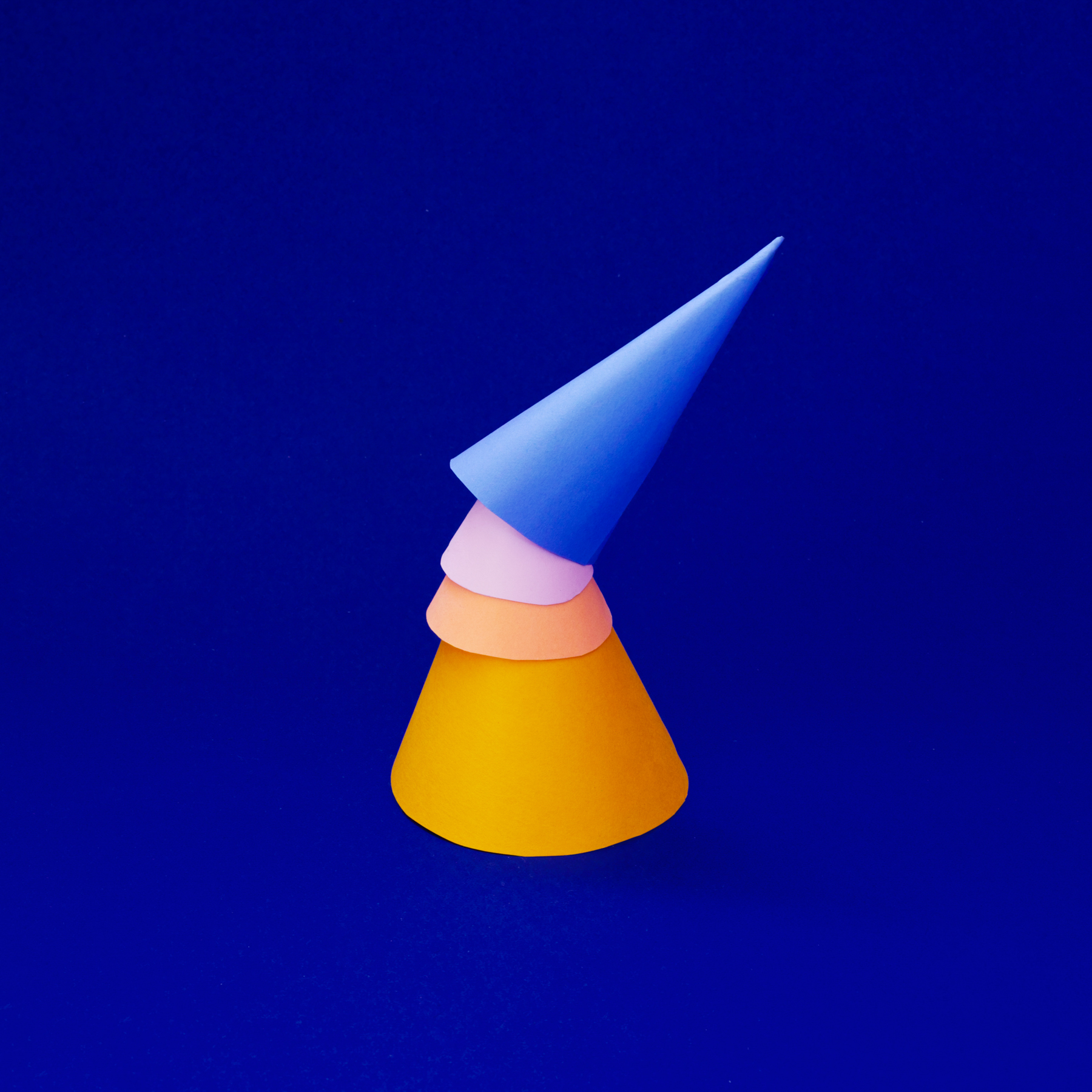 A stack of paper cones before the weave